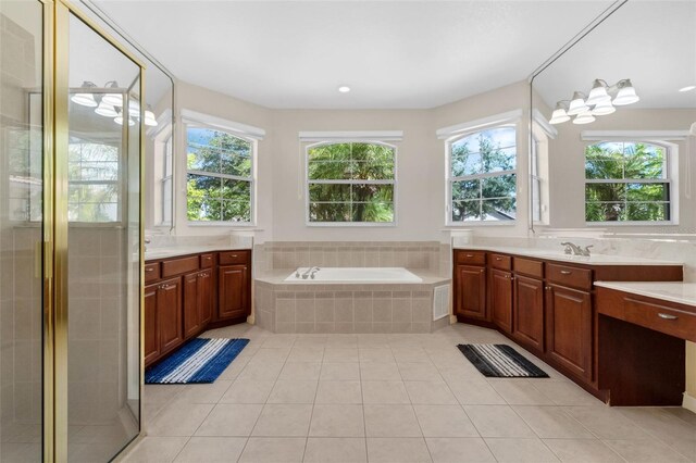 2801 Boat Cove Cir, Kissimmee, FL 34746 - bathroom with a bath, tile patterned flooring, two vanities, and a stall shower