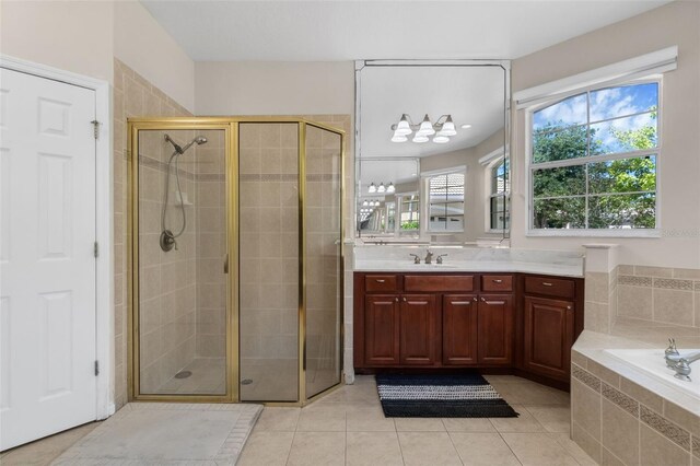 2801 Boat Cove Cir, Kissimmee, FL 34746 - bathroom with a shower stall, vanity, tile patterned floors, and a bath