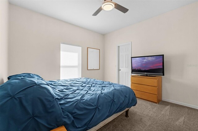 2801 Boat Cove Cir, Kissimmee, FL 34746 - carpeted bedroom featuring baseboards and a ceiling fan