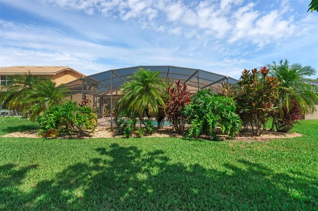 2801 Boat Cove Cir, Kissimmee, FL 34746 - view of grassy yard featuring glass enclosure