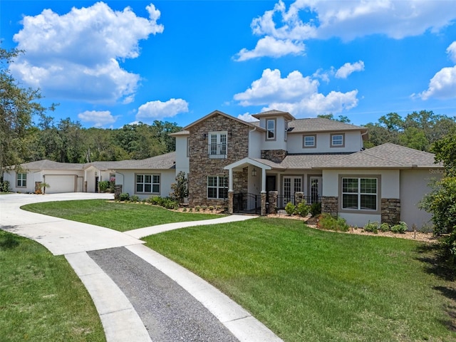 20199 Sweetwood Ln, Clermont, FL 34715 - view of front facade featuring stone siding, stucco siding, a front yard, and concrete driveway