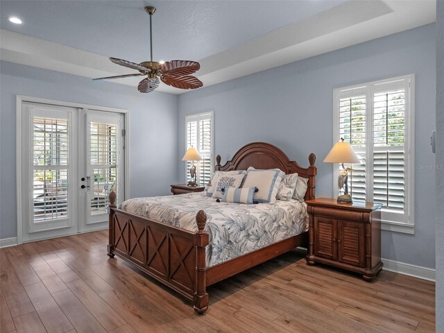 20199 Sweetwood Ln, Clermont, FL 34715 - bedroom with access to outside, wood finished floors, baseboards, recessed lighting, and a ceiling fan