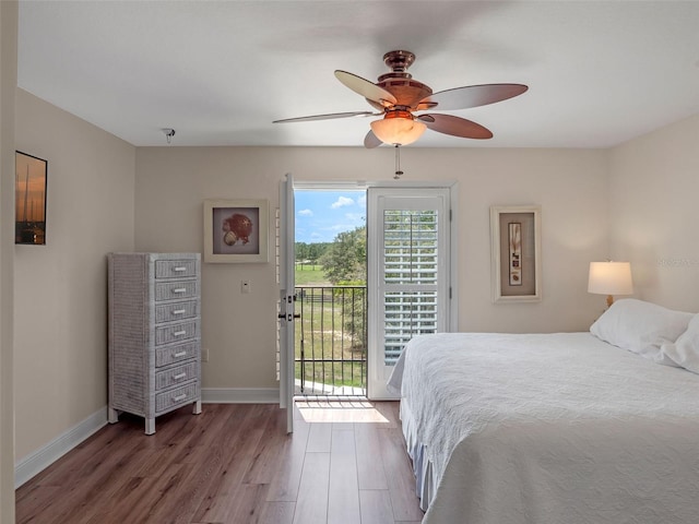 20199 Sweetwood Ln, Clermont, FL 34715 - bedroom with access to outside, wood finished floors, baseboards, and ceiling fan