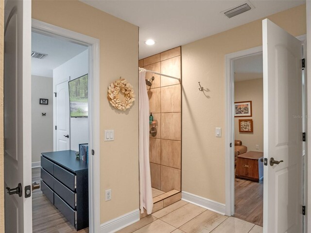 20199 Sweetwood Ln, Clermont, FL 34715 - full bathroom with tiled shower, baseboards, wood finished floors, and recessed lighting