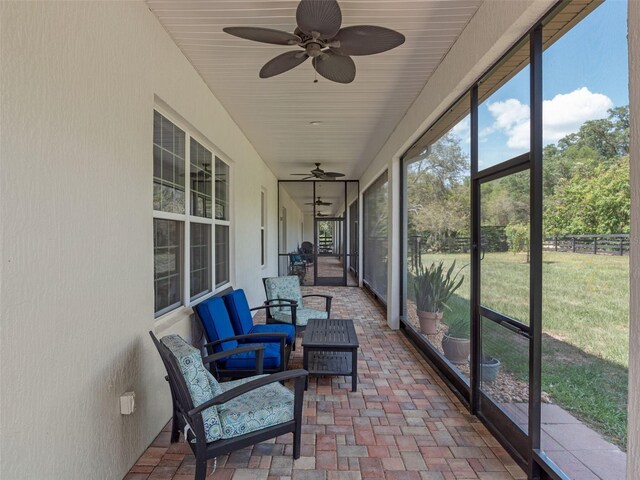 20199 Sweetwood Ln, Clermont, FL 34715 - sunroom featuring a ceiling fan and outdoor lounge area