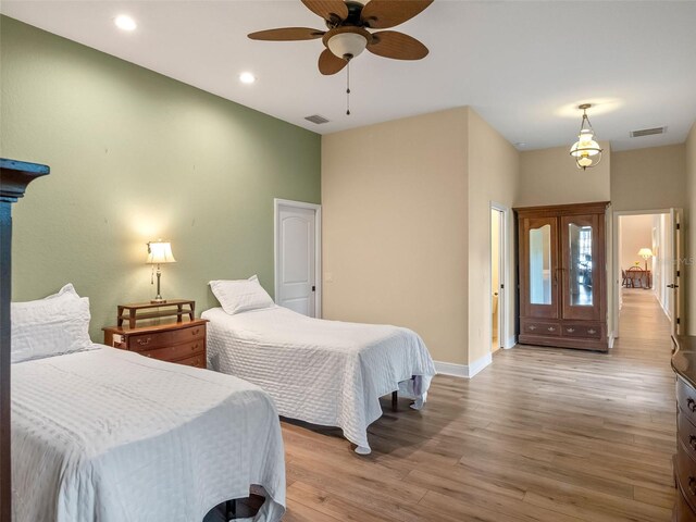 20199 Sweetwood Ln, Clermont, FL 34715 - bedroom featuring light wood-type flooring, baseboards, recessed lighting, and a ceiling fan