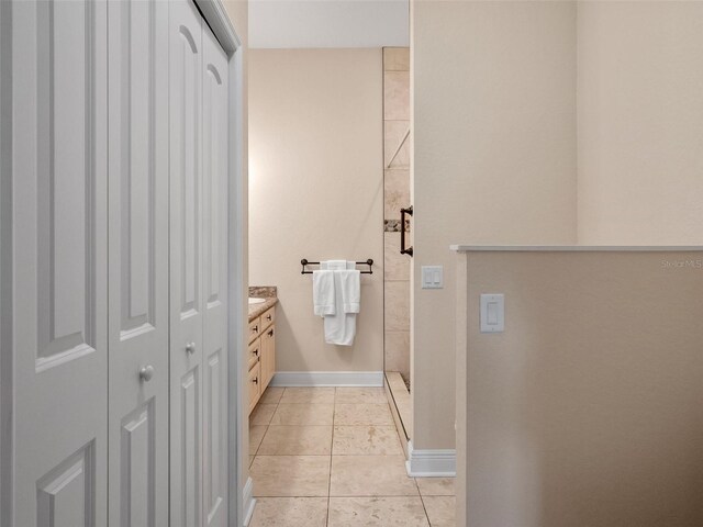 20199 Sweetwood Ln, Clermont, FL 34715 - full bathroom featuring a closet, tile patterned flooring, vanity, and baseboards