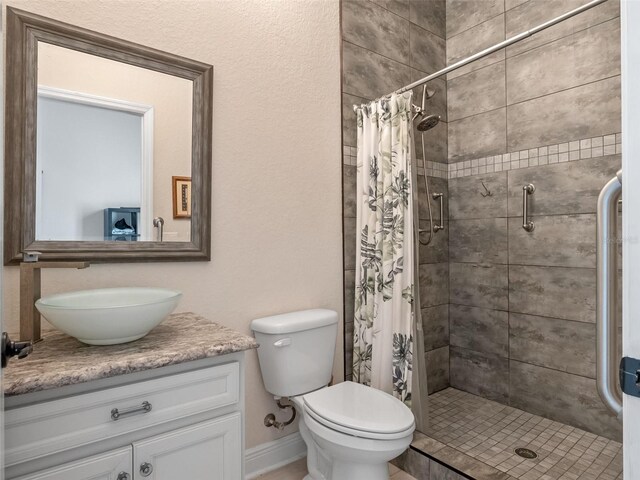 20199 Sweetwood Ln, Clermont, FL 34715 - bathroom with a stall shower, vanity, and toilet