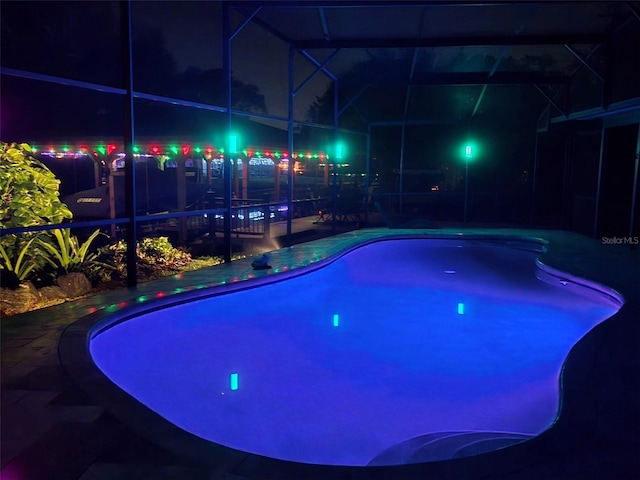 5370 Whispering Pine Cir, Saint Cloud, FL 34771 - pool at twilight featuring a lanai and a patio
