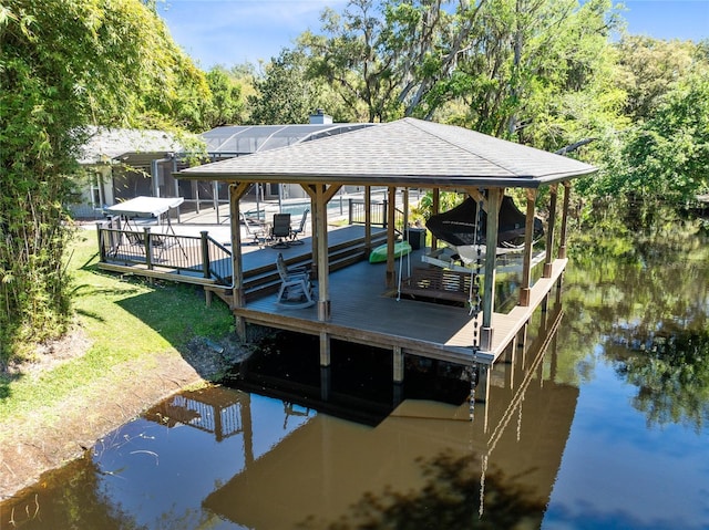 5370 Whispering Pine Cir, Saint Cloud, FL 34771 - dock featuring boat lift, glass enclosure, and a water view