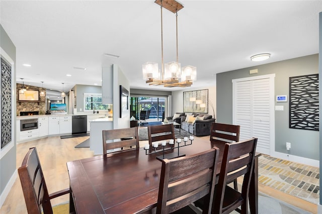 5370 Whispering Pine Cir, Saint Cloud, FL 34771 - dining area featuring a chandelier, baseboards, and recessed lighting