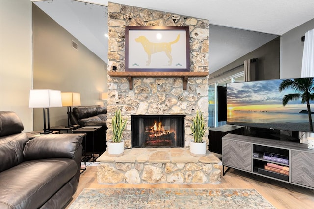 5370 Whispering Pine Cir, Saint Cloud, FL 34771 - living area with wood finished floors and a stone fireplace