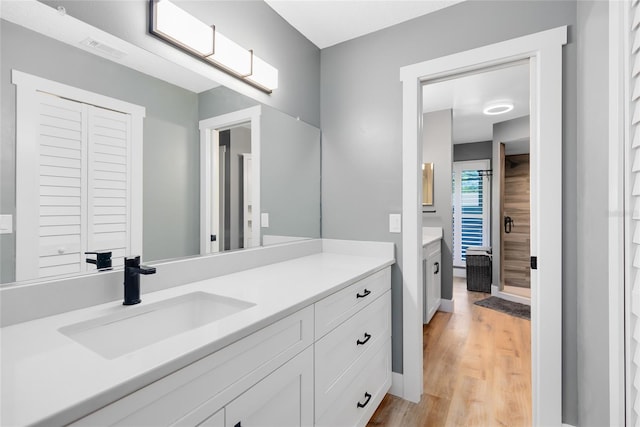 5370 Whispering Pine Cir, Saint Cloud, FL 34771 - bathroom with vanity and wood finished floors