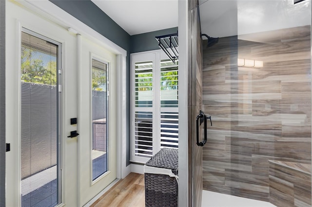 5370 Whispering Pine Cir, Saint Cloud, FL 34771 - bathroom with a stall shower and wood finished floors