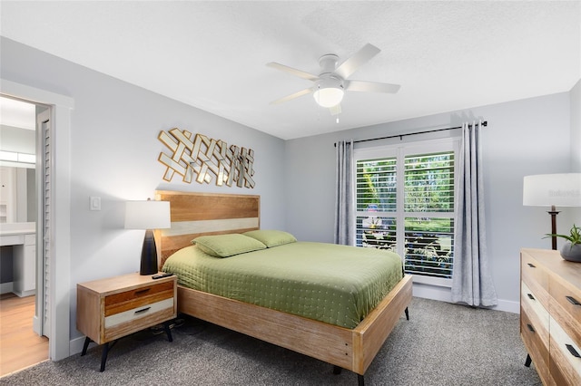 5370 Whispering Pine Cir, Saint Cloud, FL 34771 - bedroom with carpet floors, baseboards, and a ceiling fan