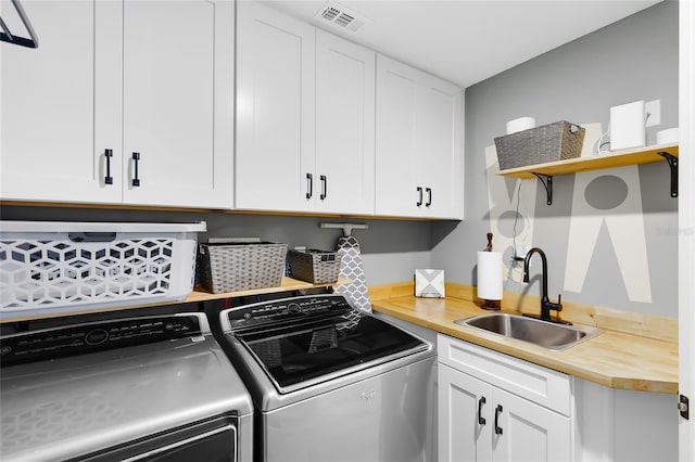 5370 Whispering Pine Cir, Saint Cloud, FL 34771 - laundry area with washer and dryer and cabinet space