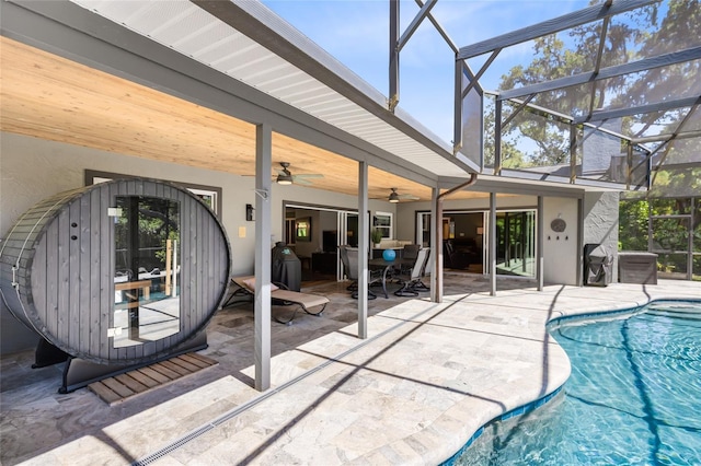 5370 Whispering Pine Cir, Saint Cloud, FL 34771 - outdoor pool with ceiling fan, a patio area, and glass enclosure