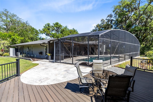 5370 Whispering Pine Cir, Saint Cloud, FL 34771 - deck with an outdoor pool, a lawn, a patio, and a lanai