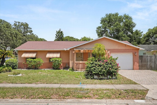 2933 N Chickasaw Trl, Orlando, FL 32817 - single story home featuring a garage, decorative driveway, brick siding, and stucco siding