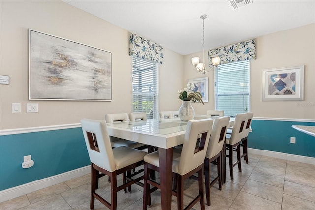 5353 Oakbourne Ave, Davenport, FL 33837 - dining room with a chandelier, plenty of natural light, baseboards, and light tile patterned flooring
