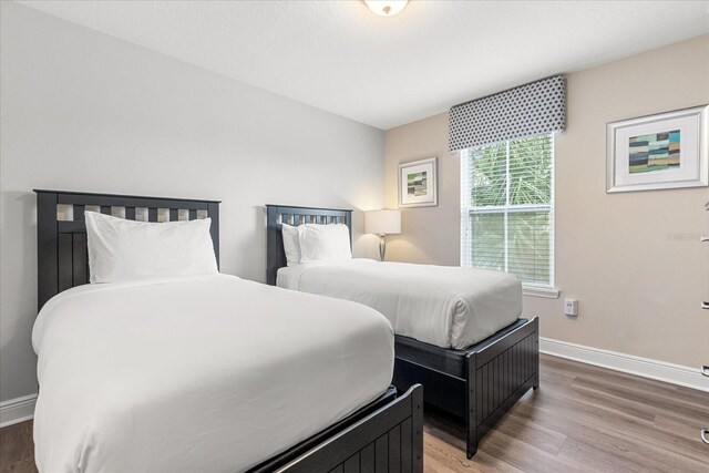 5353 Oakbourne Ave, Davenport, FL 33837 - bedroom with wood finished floors and baseboards