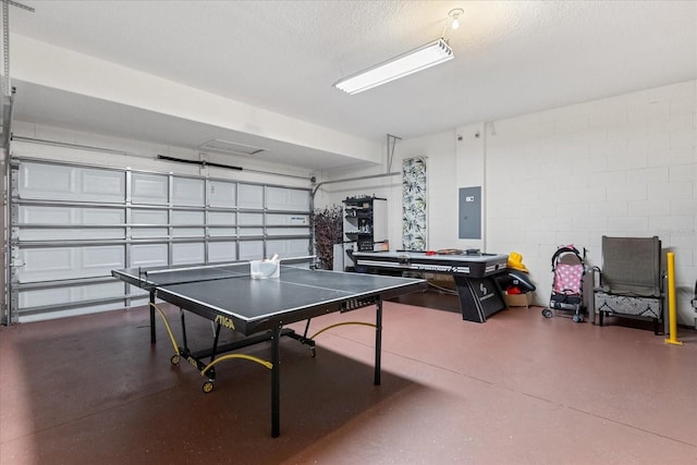 5353 Oakbourne Ave, Davenport, FL 33837 - rec room featuring electric panel, a garage, concrete block wall, and concrete flooring