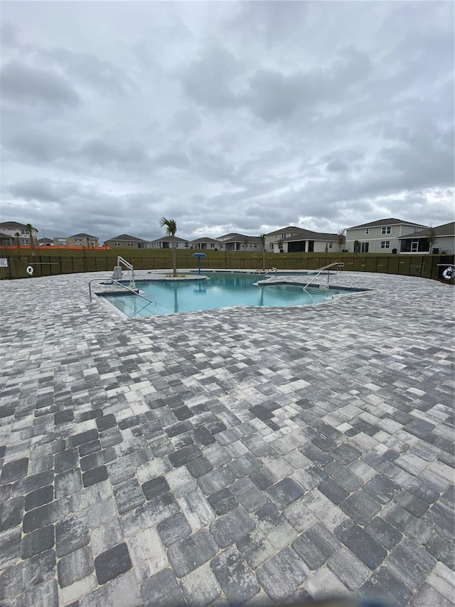 community pool featuring a patio area