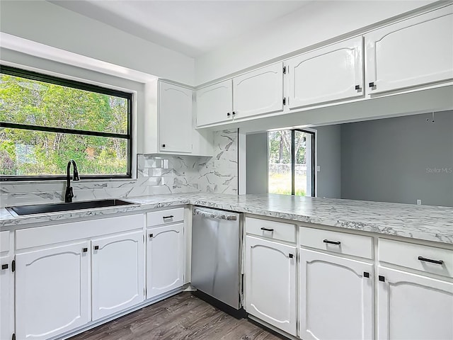 43 Lake Court Loop, Ocala, FL 34472 - kitchen featuring dishwasher, a sink, white cabinetry, and healthy amount of natural light