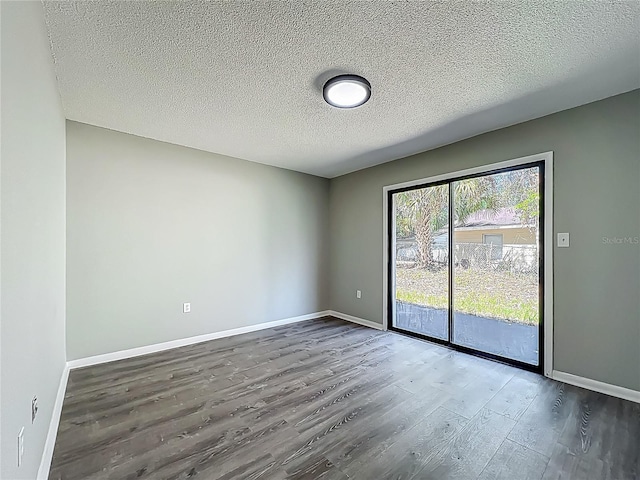 43 Lake Court Loop, Ocala, FL 34472 - unfurnished room with wood finished floors, baseboards, and a textured ceiling