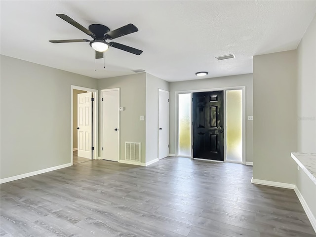 43 Lake Court Loop, Ocala, FL 34472 - foyer entrance with wood finished floors, baseboards, and ceiling fan