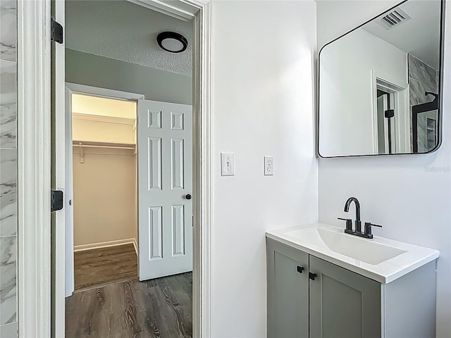 43 Lake Court Loop, Ocala, FL 34472 - bathroom with wood finished floors and vanity