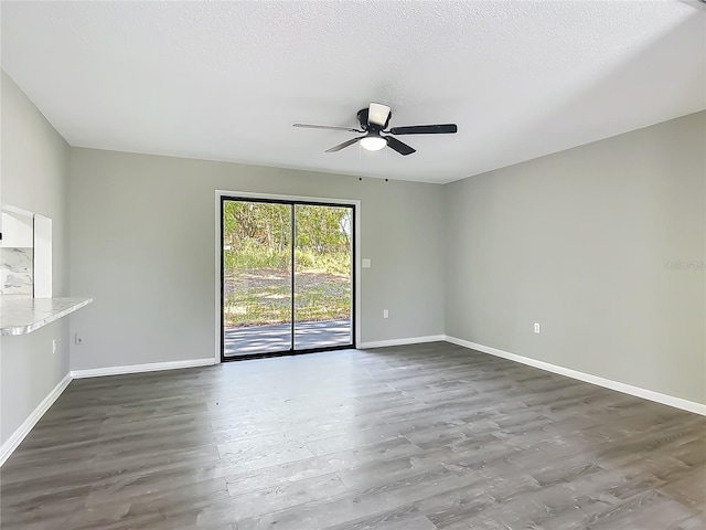 43 Lake Court Loop, Ocala, FL 34472 - spare room with ceiling fan, wood finished floors, and baseboards