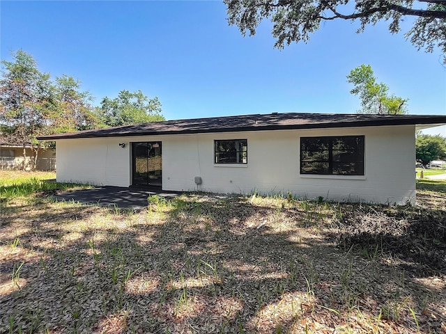 43 Lake Court Loop, Ocala, FL 34472 - back of property featuring a patio area