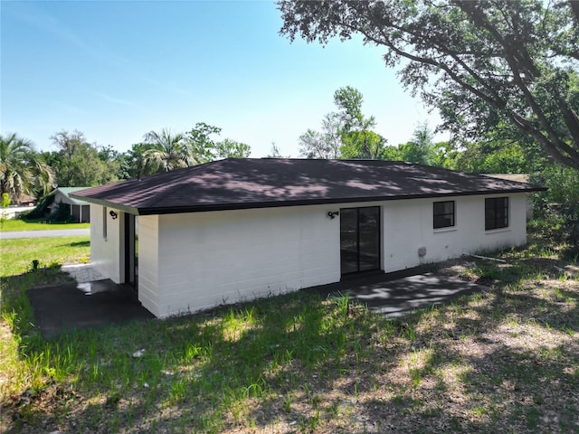 43 Lake Court Loop, Ocala, FL 34472 - back of property with a patio area and a shingled roof