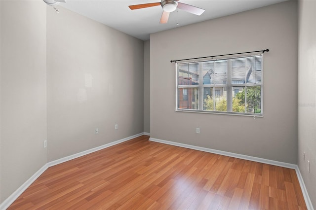 2411 W Horatio St Unit 537, Tampa, FL 33609 - empty room featuring ceiling fan, light wood finished floors, and baseboards