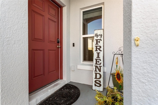 281 Primrose Dr, Davenport, FL 33837 - doorway to property featuring stucco siding