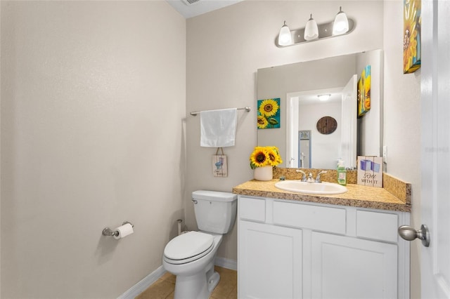 281 Primrose Dr, Davenport, FL 33837 - bathroom with vanity, toilet, baseboards, and tile patterned floors
