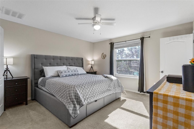 281 Primrose Dr, Davenport, FL 33837 - bedroom with light colored carpet, baseboards, and a ceiling fan