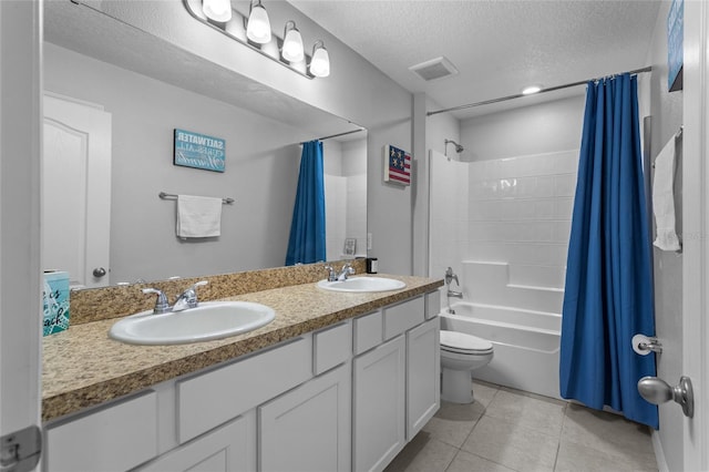 281 Primrose Dr, Davenport, FL 33837 - full bathroom with toilet, shower / tub combo, double vanity, a textured ceiling, and tile patterned floors
