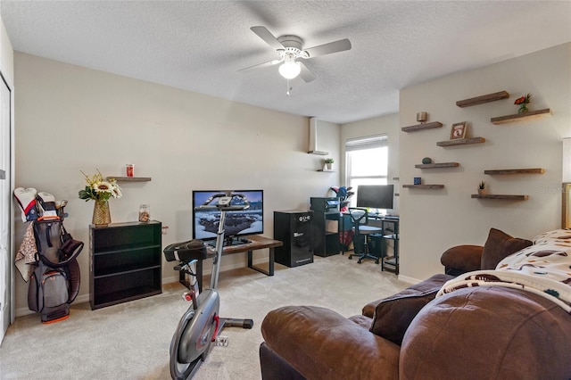 281 Primrose Dr, Davenport, FL 33837 - carpeted living area with ceiling fan, a desk, a textured ceiling, and baseboards