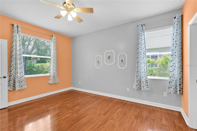 3677 Serena Ln, Clermont, FL 34711 - empty room featuring wood finished floors, a ceiling fan, and baseboards