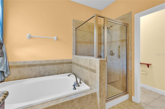 3677 Serena Ln, Clermont, FL 34711 - full bathroom featuring a garden tub, a shower stall, and tile patterned floors