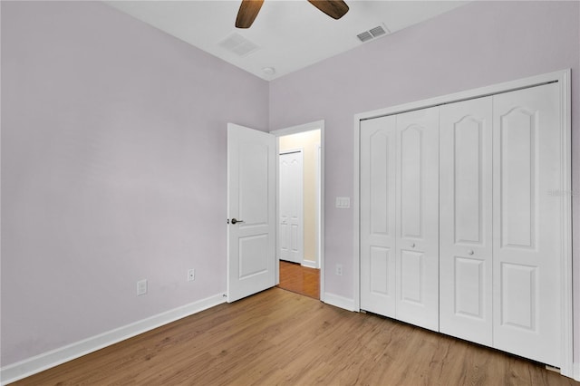 3677 Serena Ln, Clermont, FL 34711 - unfurnished bedroom with wood finished floors, baseboards, a closet, and ceiling fan