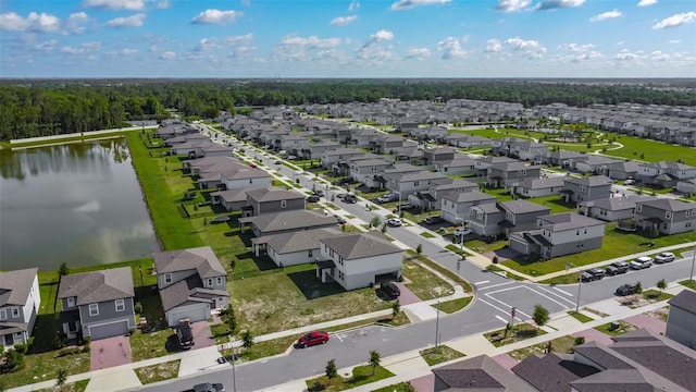aerial perspective of suburban area with a large body of water