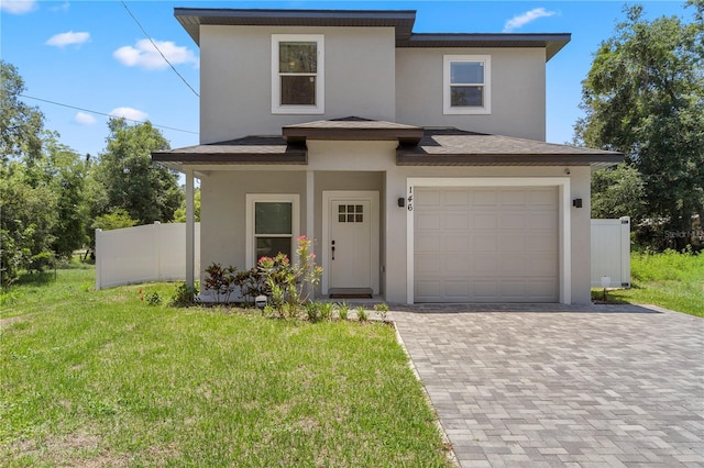 146 E 15th St, Apopka, FL 32703 - view of front of property with stucco siding, decorative driveway, a garage, and a shingled roof