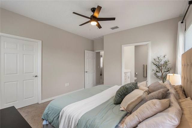 146 E 15th St, Apopka, FL 32703 - bedroom featuring light carpet, connected bathroom, ceiling fan, and baseboards