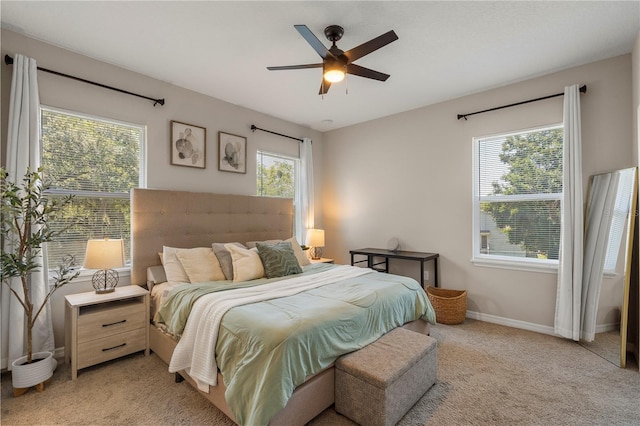 146 E 15th St, Apopka, FL 32703 - bedroom featuring light colored carpet, baseboards, and ceiling fan