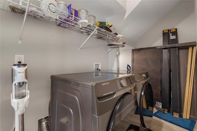 146 E 15th St, Apopka, FL 32703 - washroom with washer and dryer and wood finished floors