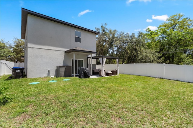 146 E 15th St, Apopka, FL 32703 - rear view of property featuring stucco siding, a patio area, and an outdoor hangout area