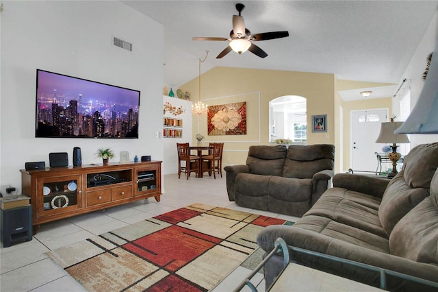 204 Bay Meadow Dr, Kissimmee, FL 34746 - living area featuring arched walkways, light tile patterned flooring, ceiling fan, high vaulted ceiling, and a chandelier